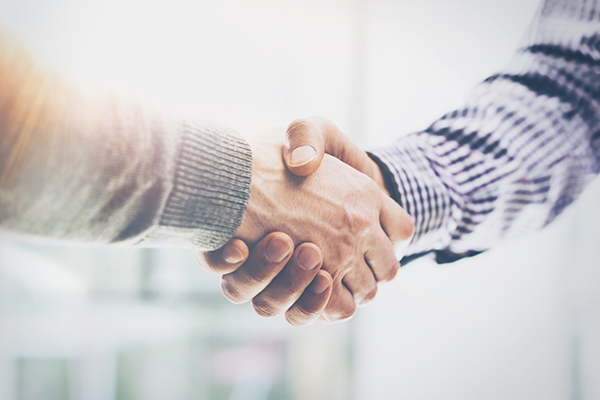 Two people shaking hands