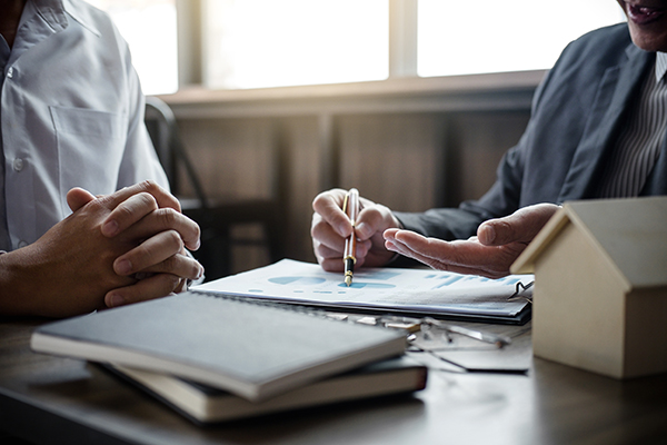 Two people discussing mortgages